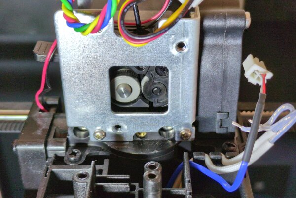 View into the partially disassembled extruder<br/>direct driven shaft on the center left, spring loaded bearing on the center right