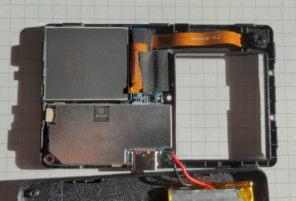 Backside after removing screws and back cover.<br/>Clockwise: LCD backside, camera, space for the battery, USB-C connector, PCB RF-shield, custom <code>SE2010H</code> chip, side button